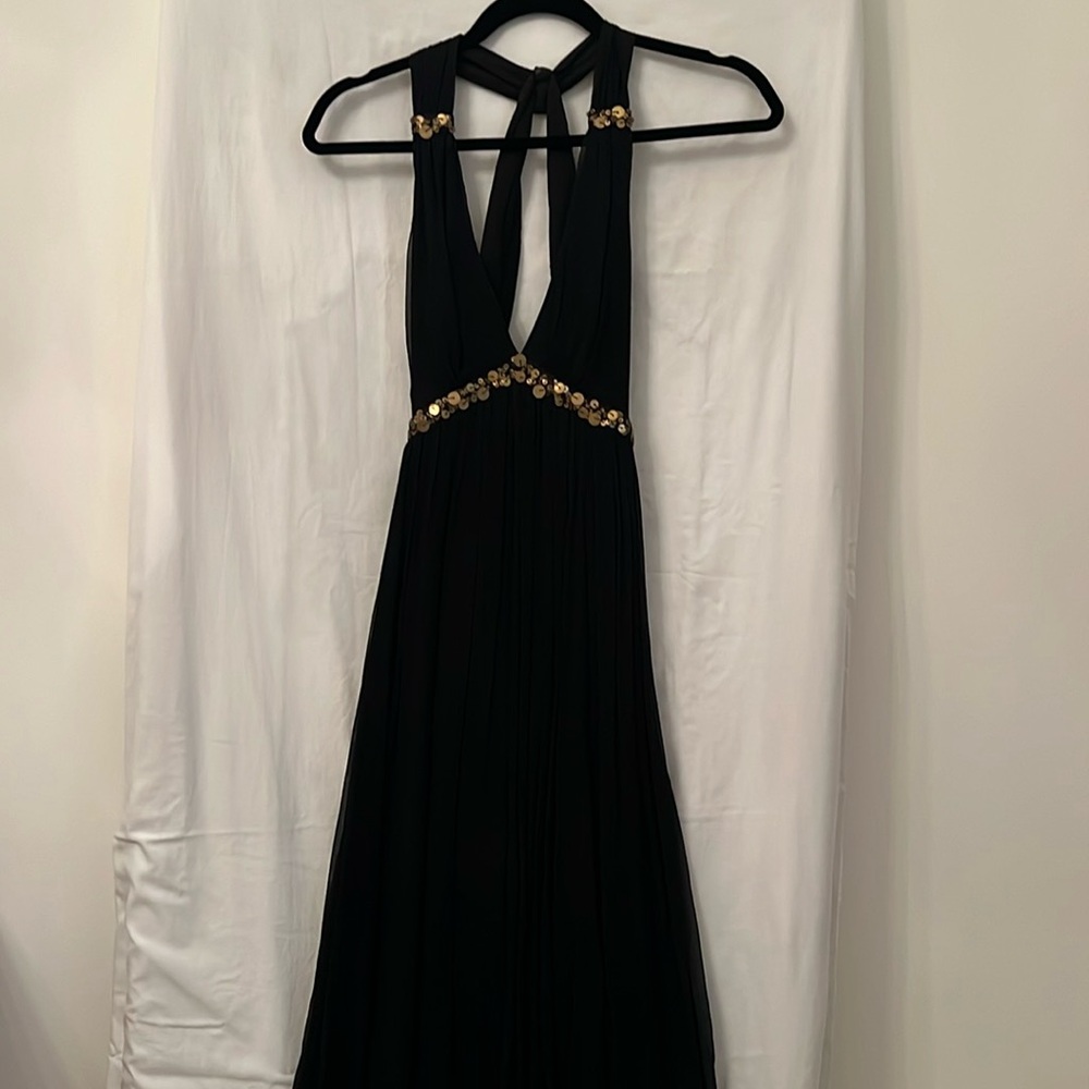 Reid’s black Flowy Cut out Back Cocktail Dress with Bronze Sequin Trim